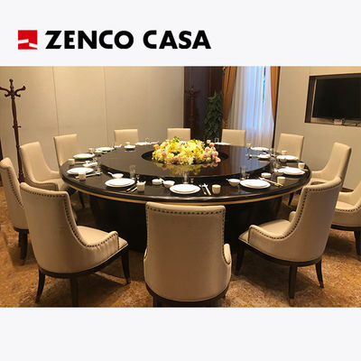 Mesa de comedor eléctrica con sillas de cuero para 12 en el restaurante del hotel